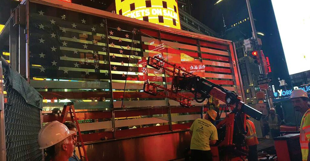 Renovation work at the Times Square military recruitment booth in 2017 included enhancements to the now-iconic U.S. flags illuminated along the booth’s sides.