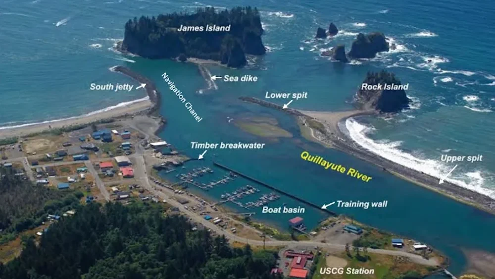 Aerial photo of the lower half-mile of the Quillayute estuary, the marina and waterfront area of La Push, and a portion of the eastern shore of James Island, Washington, where the U.S. Army Corps of Engineers, Seattle District plans to repair the Quillayute Sea dike in September 2023. The dike is vital to support the Coast Guard Station Quillayute River, which performs search-and-rescue operations from the marina located on the reservation, and whose responsibility covers 63 miles of the Pacific Ocean coast and extends 50 nautical miles offshore.