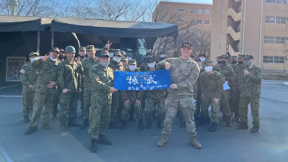 U.S. Army 1st Lieutenant Andrew Gilbert, a project engineer with the U.S. Army Corps of Engineers – Japan Engineer District (USACE JED) Kanagawa Resident Office, poses with members of the 3rd company’s Eastern Army Japanese Ground Self- Defense Force (JGSDF) members for a commemorative photo, at Camp Asaka, February 2023. Gilbert, through the U.S. Army Japan’s (USARJ) Bilateral Co-Op Program, went to the JGSDF camp to learn their engineering mission, and immerse in Japanese culture. (USACE Photo by U.S. Army 1st Lieutenant Andrew Gilbert)