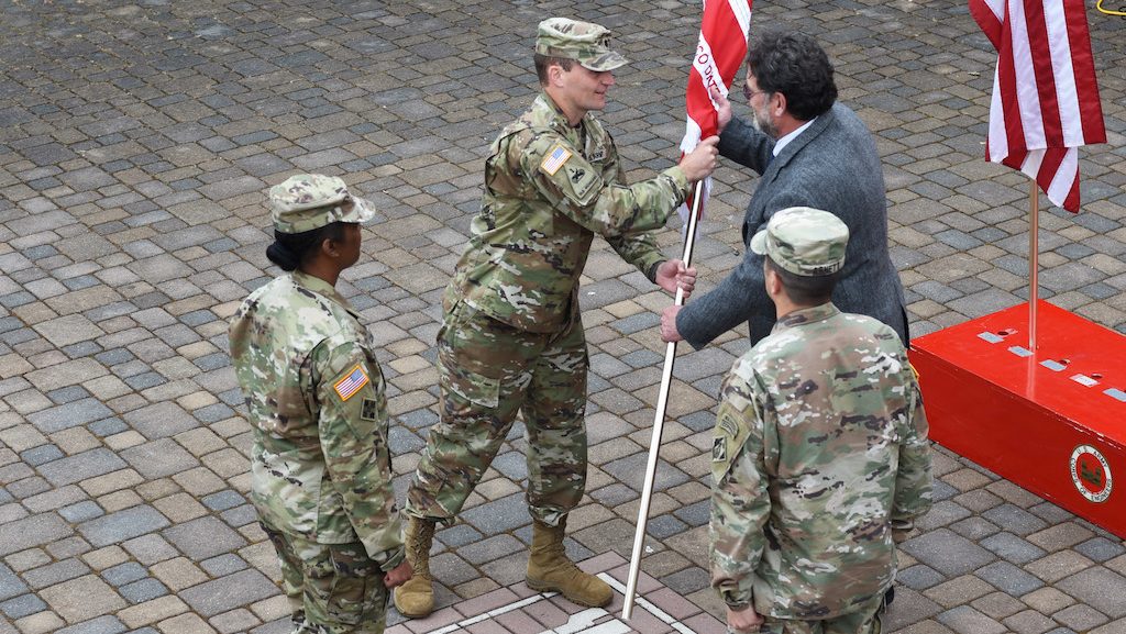 Lt. Col. Timothy Shebesta takes command of the U.S. Army Corps of Engineers San Francisco District guidon during a ceremony June 23 at the Bay Model Visitor Center in Sausalito, Calif. Prior to this, Shebesta served as a Professor of Military Science at Marquette University.