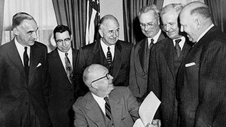 President Eisenhower signs the Federal Highway Act of 1956, authorizing the construction of the Interstate Highway System. President Eisenhower signs the Federal Highway Act of 1956, authorizing the construction of the Interstate Highway System. (Photo courtesy of the Federal Highway Administration)