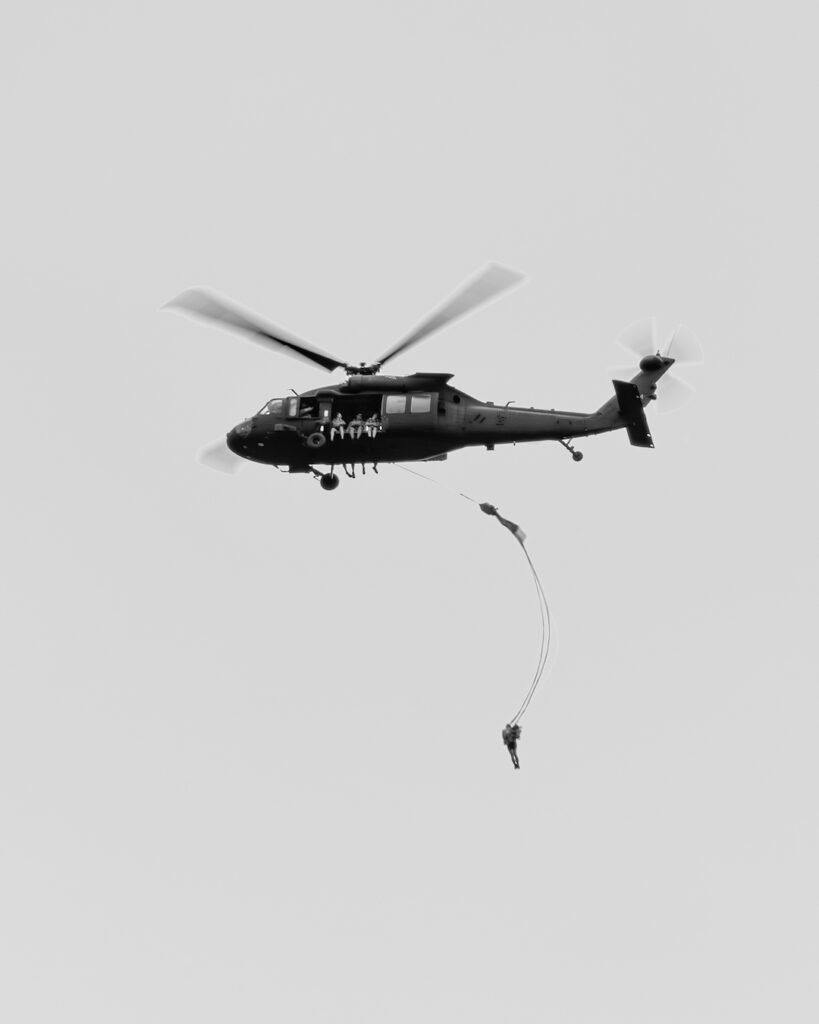 U.S. Army Corps of Engineers, Louisville District park rangers and Kentucky Fish and Wildlife officers cordon off a 'drop zone' for paratroopers to jump into Green River Lake, Aug. 5, 2023 in Campbellsville, Kentucky. Soldiers with the Kentucky National Guard and other units practiced water jumps from a UH-60 Blackhawk helicopter as family members and Green River Lake visitors watched from the dam and shoreline. (U.S. Army Corps of Engineers photo by Charles Delano)