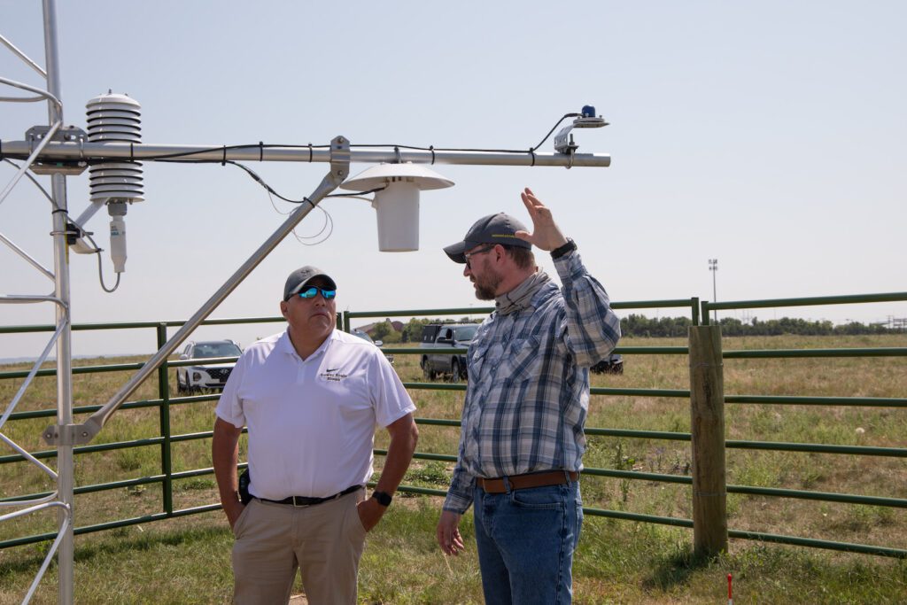 people with weather monitoring equipment