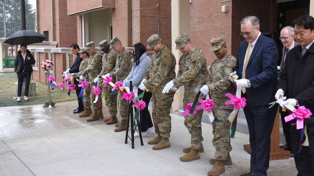 Representatives from the 19th Expeditionary Sustainment Command, 8th Army, U.S. Army Corps of Engineers – Far East District, U.S. Army Garrison – Daegu and the first family to live in a new housing tower cut the ribbon on the facility in a ceremony at Camp Walker, South Korea, on Feb. 29, 2024. The tower is the fourth and final on the installation, creating spaces for 360 service members and their families to live in while station in the heart of Daegu. USACE PHOTO BY RACHEL NAPOLITAN