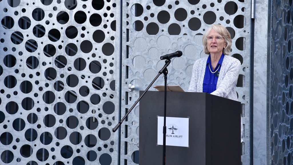 Denise Williams, daughter of the late Col. Gail S. Halvorsen, speaks at a ceremony dedicating the new air traffic control tower on the Clay Kaserne portion of U.S. Army Garrison Wiesbaden in her father’s name June 15, 2024.