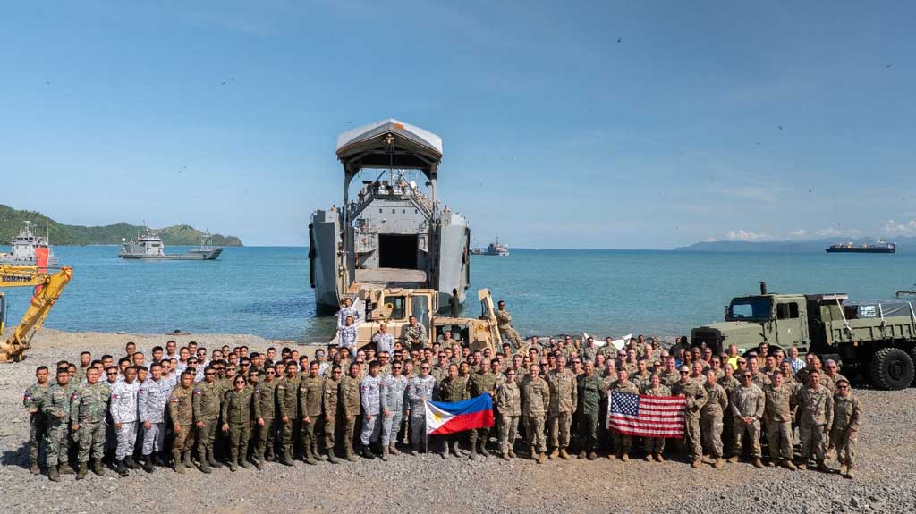 Participants pose for a group picture during joint exercise Balikatan 25 in Dingalan, Philippines. U.S. Army Engineer Research and Development Center (ERDC) researchers Dr. Tim Rushing, Zach Tyler, Mason Anglin, and Staley Boc (not pictured) supported beach landing operations with in-person engineering and technical guidance of the ERDC’s Submersible Matting system during this year’s exercise.