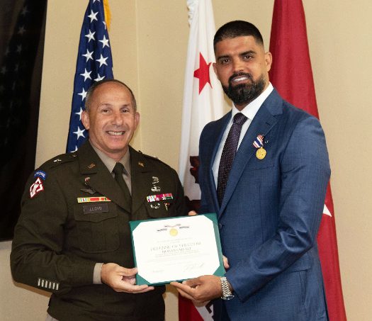 Mohannad Ali of San Diego, right, poses for a picture with Brig. Gen. John Lloyd, U.S. Army Corps of Engineers South Pacific Division commander, left, after receiving the Secretary of Defense Medal for the Defense of Freedom during an Aug. 26 ceremony in San Diego. Ali received the medal for his actions in 2010, after being injured while on assignment in Iraq for the USACE Gulf Region District. The medal, the civilian equivalent of the Purple Heart, honors Department of Defense civilian employees who are killed or wounded by hostile action, while serving in support of the DOD. (Photo by Dena O’Dell, U.S. Army Corps of Engineers Los Angeles District) (Photo Credit: Courtesy)