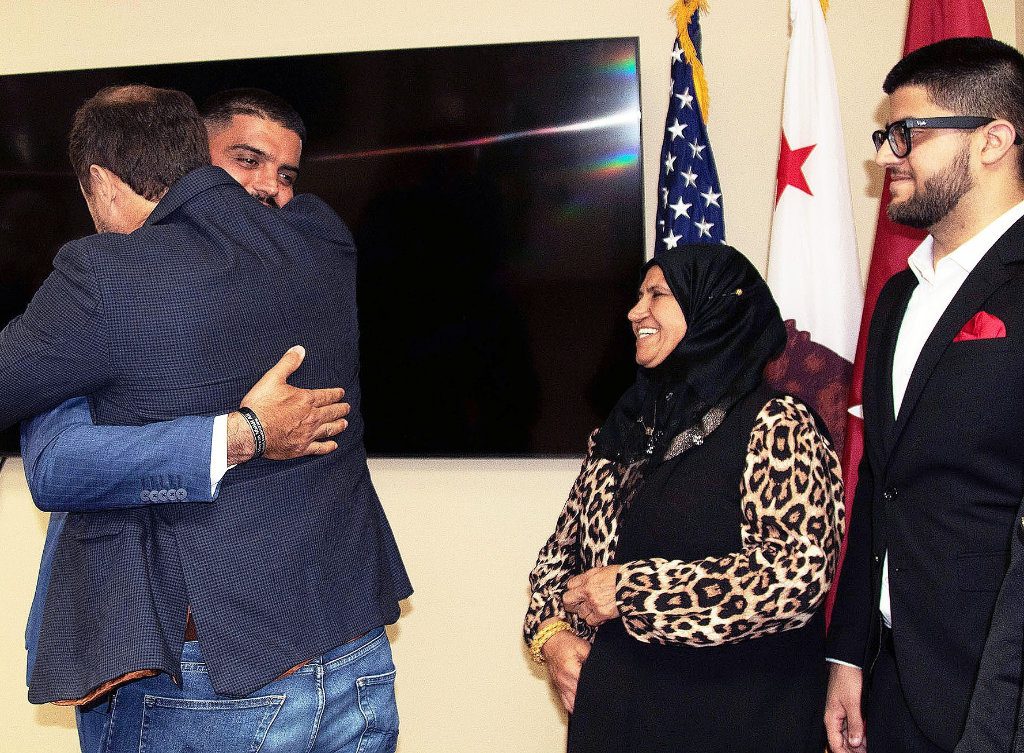 Mohannad Ali of San Diego, left, receives a hug from his friend, Michael Moreno of San Diego, second from left, following an Aug. 26 ceremony in San Diego, while Ali’s mother, Kifah Mohammed, center, and Mohannad Ali’s brother, Ali Ali, look on. During the ceremony, Mohannad Ali was presented with the Secretary of Defense Medal for the Defense of Freedom, stemming from his actions after being injured while serving as a U.S. Army Corps of Engineers’ contractor in 2010 in Iraq. (Photo by Dena O’Dell, U.S. Army Corps of Engineers Los Angeles District) (Photo Credit: Courtesy)