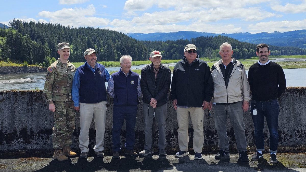 Past and Present Portland District EmployeesRick Goodell, Terry Connell, Kevin Brice, Mike Roll, COL Weart, Jeff Hicks, and Steve Stockton stand on the SRS with the Toutle River in the background. 