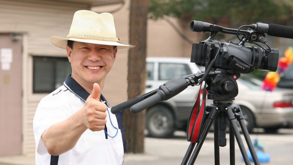 A smile for a career well spent: Visual Information Specialist Yo Kyong-il, who followed in his father’s footsteps into the U.S. Army Corps of Engineers – Far East District in 1985, pauses beside his camera. Now serving alongside his daughter, Mr. Yo retires in March 2026, leaving behind a three-generation family legacy of service to the district. USACE PHOTO BY CHONG YUN KIM