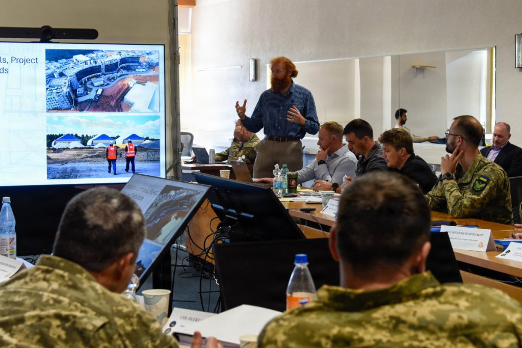 U.S. Army Corps of Engineers, Europe District Program and Project Management Division, Program Support Branch Chief Chris Tolson addresses officers from Ukraine’s State Special Transport Service during the Strategic Program and Project Delivery workshop April 28 at McCully Barracks in Wackernheim, Germany. The goal of this workshop was to empower Ukraine to be able to better lead aspects of its own recovery by familiarizing SSTS representatives with advanced approaches to implementing large-scale infrastructure projects that will support the recovery and protection of critical infrastructure of Ukraine. U.S. ARMY PHOTO HANNAH MITCHELL