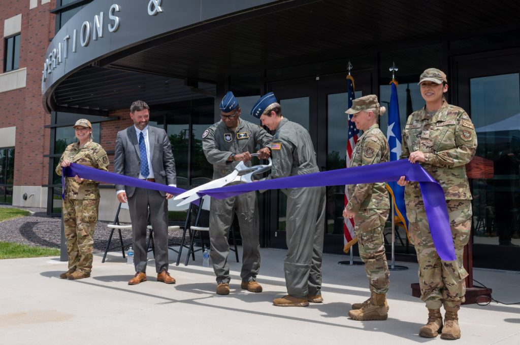 U.S. Air Force Gen. Randall Reed, United States Transportation Command commander, and Lt. Gen. Rebecca Sonkiss, Air Mobility Command interim commander, cut a ribbon during the Joint Operations and Mission Planning Center ribbon-cutting ceremony on Scott Air Force Base, May 29, 2026. The JOMPC houses both the U.S. Transportation Command’s flow element, the 618th Air Operations Center, and key elements of Air Mobility Command.(U.S. Air Force photo by Airman 1st Class Juan Bejarano)