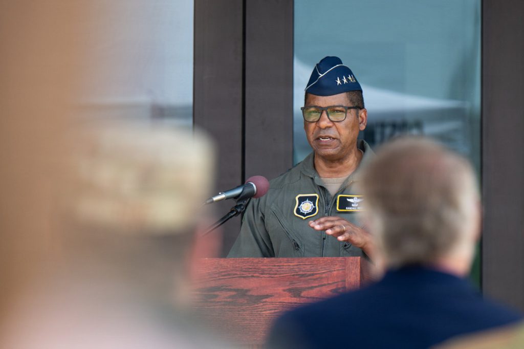 U.S. Air Force Gen. Randall Reed, U.S. Transportation Command commander, delivers remarks during the Joint Operations and Mission Planning Center ribbon-cutting ceremony on Scott Air Force Base, May 29, 2026. He said that through physical and professional unity, they are better postured to “project power and deliver hope.” The JOMPC enhances mobility professionals' ability to coordinate airlift, refueling, and aeromedical evacuation missions from a single location. USAF PHOTO SENIOR AIRMAN DE'QUAN SIMMONS