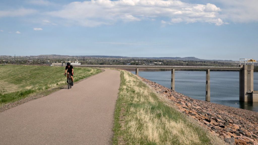 A recreator bikes across the crest of Chatfield Dam in Denver, Colorado, May 9, 2023. Chatfield Dam was the second of three dams built to reduce flooding risks in the Denver area. Located southwest of Denver on the South Platte River, construction of the dam was begun in 1967 and was completed in 1975. The dam measures approximately 13,136 feet in length with a maximum height of 147 feet from the streambed to the top of the dam. Members of a dam inspection team from the U.S. Army Corps of Engineers, Omaha District, finish inspecting the intake structure of the Branched Oak Dam located north of Lincoln, Nebraska, June 2, 2025. The intake structure controls the amount of water released through the dam. A periodic inspection of the dam is conducted every five years to identify potential defects and to ensure the dam is functioning as designed. The dam is one of 10 Salt Creek dams that work together to reduce flood risk for the city of Lincoln and surrounding communities. USACE PHOTO BY DELANIE STAFFORD
