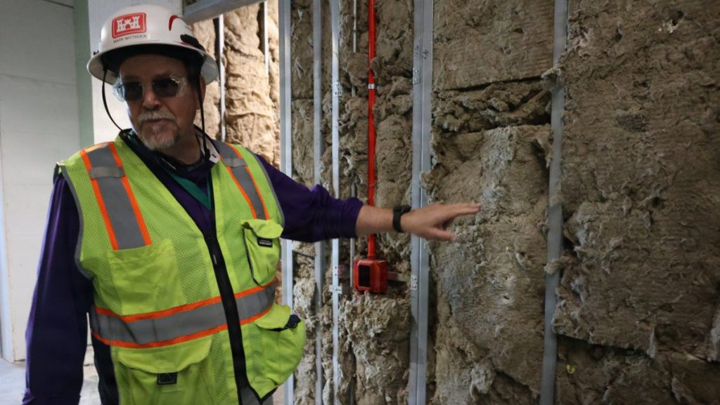 Mark Wittrock, U.S. Army Corps of Engineers, Mobile District Senior Resident engineer, emphasizes the importance of selecting the insulation for its flame-resistant properties, adding an extra layer of safety to the new construction project at Tyndall Air Force Base, Florida, May 13, 2026. Led by the U.S. Army Corps of Engineers, Mobile District, in partnership with the Air Force Civil Engineer Center’s Natural Disaster Recovery Division, the rebuild effort continues reshaping Tyndall into one of the most modern and resilient military installations in the Department of War. USACE PHOTO BY KEESHA ROBINSON