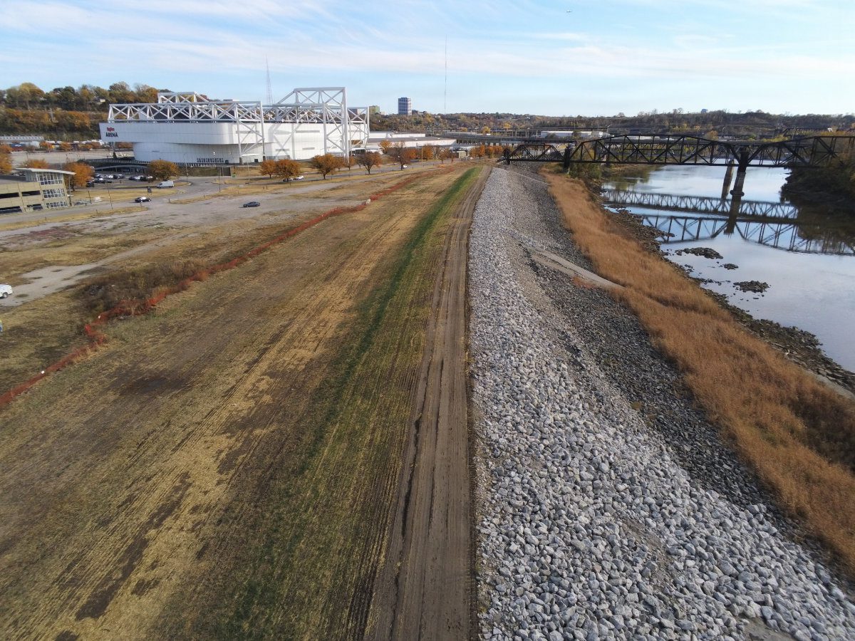View of a newly armored riprap slope section protecting the levee bank along the Kansas River.
