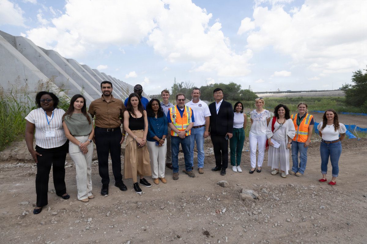 USACE leaders pose with an international delegation touring the completed Kansas Citys Levees mega project.