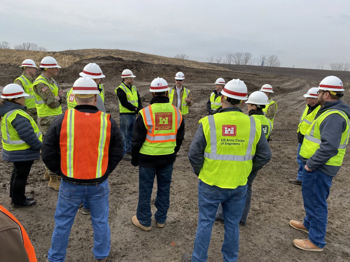 USACE project team members gathering for an on-site field safety briefing during construction of the Kansas Citys Levees.