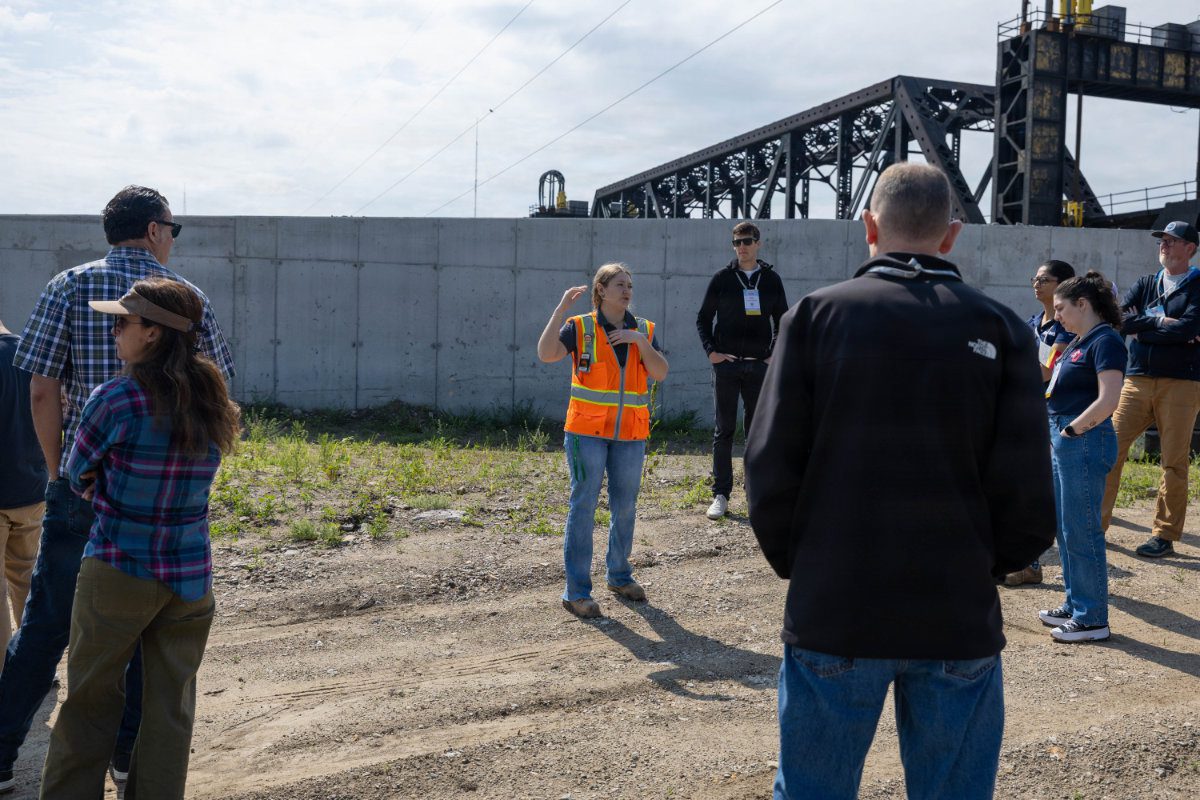 A USACE civil engineer briefing a tour group at an active Kansas Citys Levees construction site.