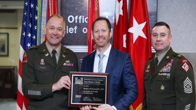 Norfolk District Program Manager, Matt Karlinchak, receives the 2025 USACE Program Manager of the Year Award from the 56th Chief of Engineers and Commanding General of the U.S. Army Corps of Engineers Lt. Gen. William H. "Butch" Graham, Jr. and Command Sergeant Major Douglas Galick at a ceremony held at the USACE headquarters building in Washington, D.C. on January 23, 2026. U.S. ARMY PHOTO BY DIANE RIVERA ESTELLA