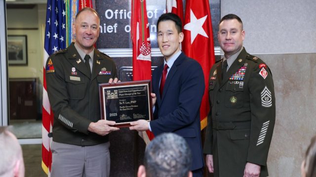 Far East District Project Manager, So Lee, receives the 2025 USACE Project Manager of the Year Award from the 56th Chief of Engineers and Commanding General of the U.S. Army Corps of Engineers Lt. Gen. William H. "Butch" Graham, Jr. and Command Sergeant Major Douglas Galick at a ceremony held at the USACE headquarters building in Washington, D.C. on January 23, 2026. U.S. ARMY PHOTO BY DIANE RIVERA ESTELLA
